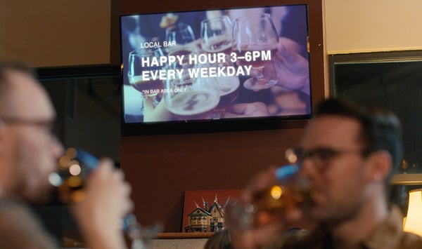Digital signage announcing Happy Hour