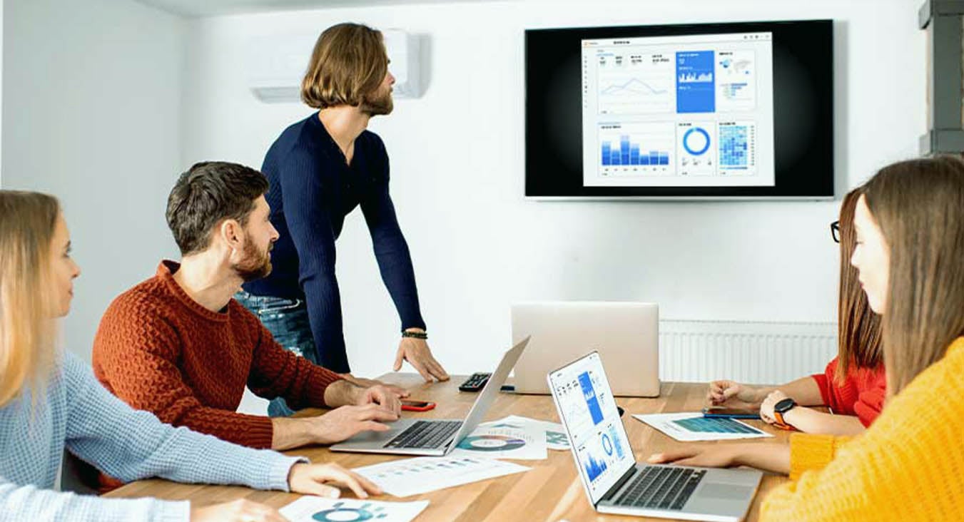 People collaborating wirelessly in a conference room