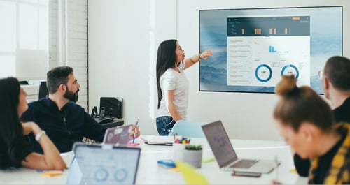 Professionals screen mirroring in a conference room