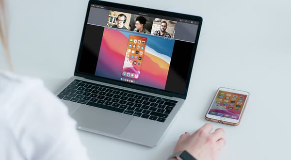 A person sharing an iPhone screen to an online videoconference meeting