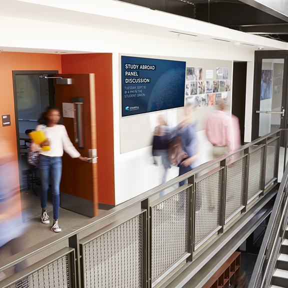 Digital signage on a TV in a school hallway