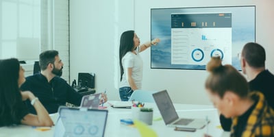 People sharing content wirelessly during a meeting